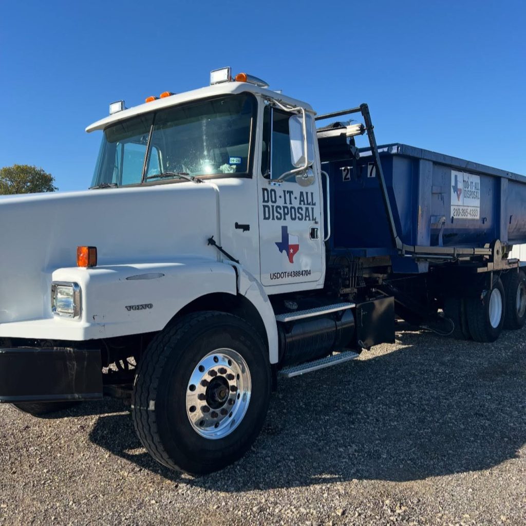 Do It All Disposal roll-off truck and blue dumpster